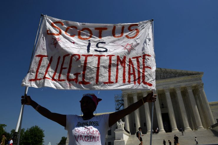 A woman holds a sign in support of abortion rights at the U.S. Supreme Court on Friday.