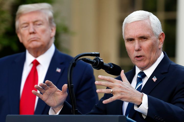 FILE - President Donald Trump listens as Vice President Mike Pence speaks about the coronavirus in the Rose Garden of the White House, April 27, 2020, in Washington.