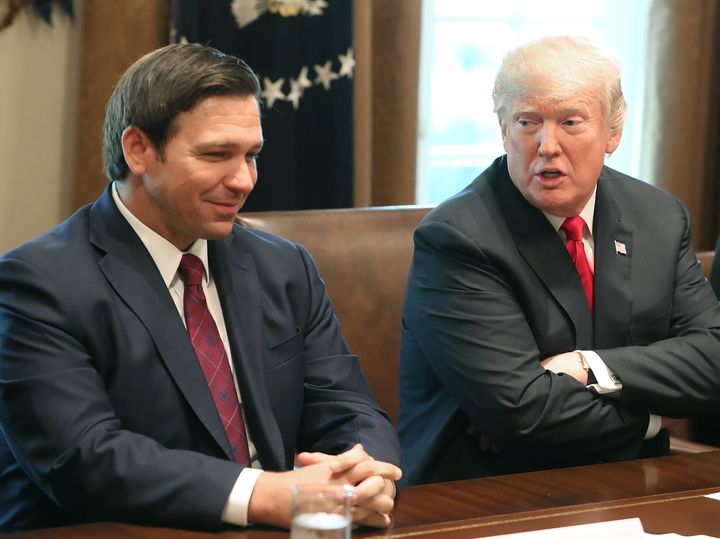 WASHINGTON, DC - DECEMBER 13: Florida Governor-elect Ron DeSantis (R) sits next to U.S. President Donald Trump during a meeting with Governors elects in the Cabinet Room at the White House on December 13, 2018 in Washington, DC. (Photo by Mark Wilson/Getty Images)