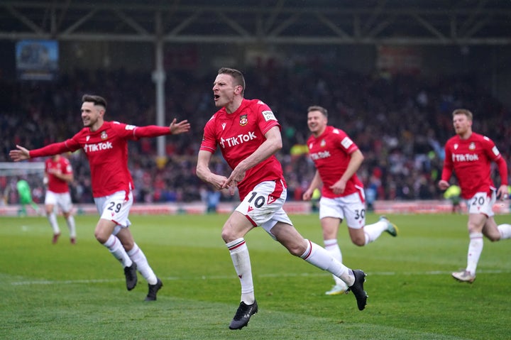 Wrexham's Paul Mullin (second left) bcelebrates scoring their side's second goal of the game during the Vanarama National League match at The Racecourse Ground, Wrexham. Picture date: Saturday April 22, 2023. (Photo by Martin Rickett/PA Images via Getty Images)