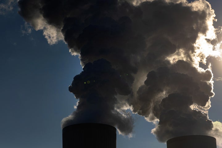 Sunlight shines through vapor rising from cooling towers. Photographer: Krisztian Bocsi/Bloomberg