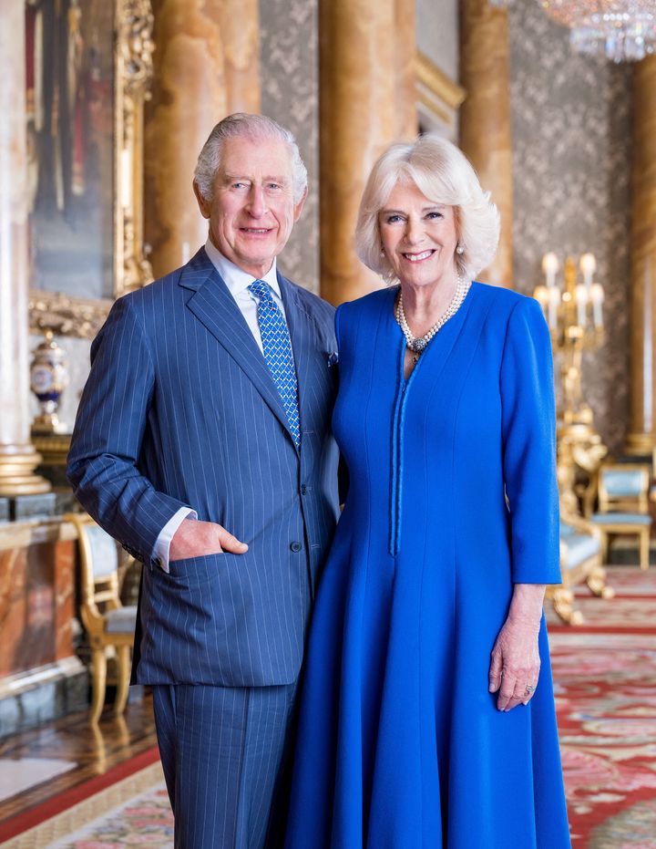 King Charles III and Queen Camilla pose for a picture, released April 4, in the Blue Drawing Room at Buckingham Palace in London.