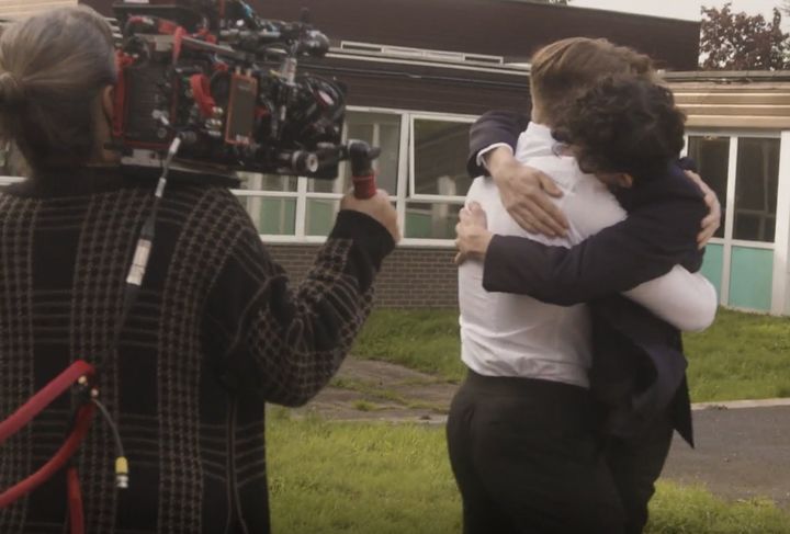 Kit Connor and Joe Locke share an embrace on the set of Heartstopper's new season