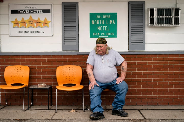 Jeff Drummond, who now resides in a motel after being displaced by the East Palestine train derailment sits outside his room in North Lima, Ohio, Monday, April 3, 2023. "I have nothing here," says Drummond. "So it's trying to find something to keep yourself busy, to keep from going crazy."