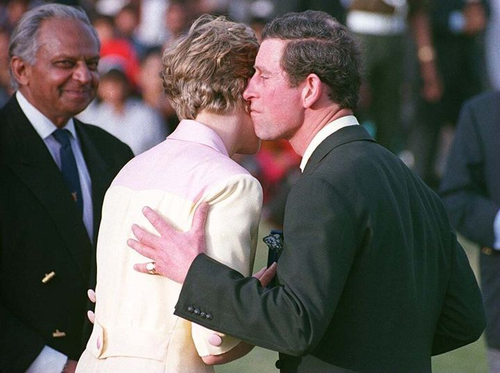 Shots like this – where Charles seems to miss his wife Diana's cheek and end up with an awkward ear kiss – were very famous at the time.