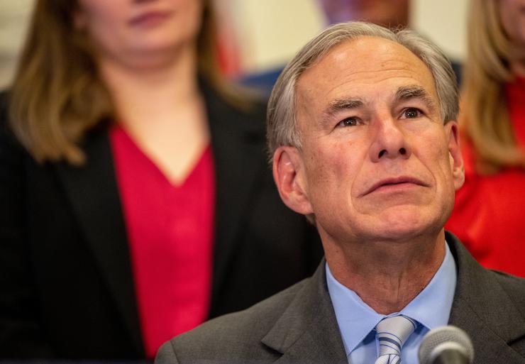 Texas Gov. Greg Abbott, shown here at a March 15 news conference in Austin, starting pushing for a pardon for man who shot a protester after Fox News' Tucker Carlson made an issue of it.