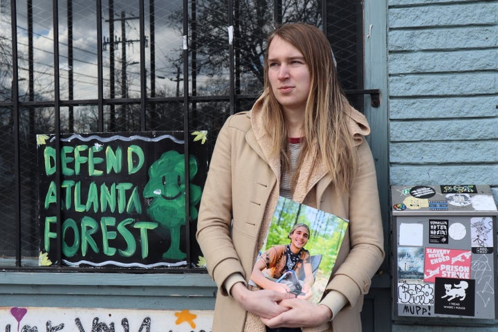 Vienna holds a photo of her slain partner, Tortuguita, in Atlanta on Jan. 26, 2023. Officials have said officers fatally shot Tortuguita in self-defense, but activists argue it was a state-sanctioned killing.