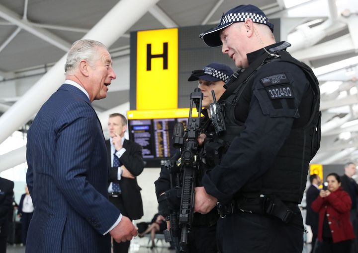 Charles meeting armed British police officers during a visit to Heathrow Airport in west London in 2018.