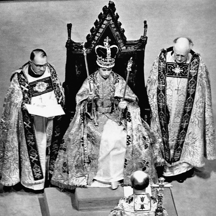 Queen Elizabeth II wearing the St. Edward Crown and carrying the Sceptre and the Rod after her Coronation in Westminster Abbey, London. 