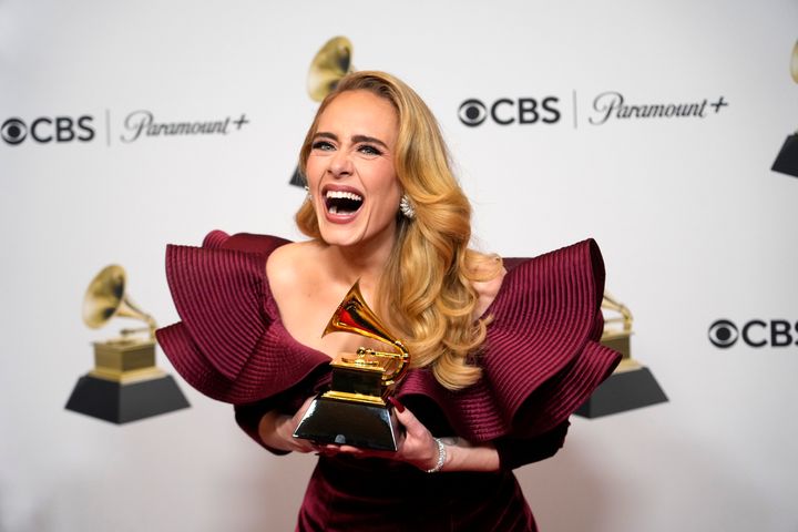 Adele shows off her Grammy for best pop solo performance at the 2023 awards on Feb. 5, 2023. (AP Photo/Jae C. Hong)