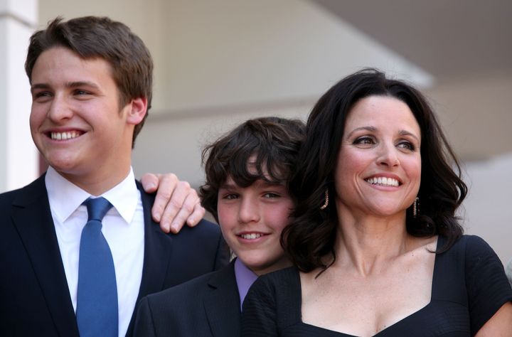Louis-Dreyfus had her first son Henry (left) in 1992 and second son Charlie (center) in 1997.
