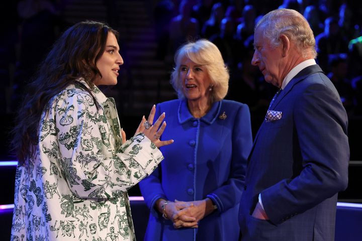 King Charles III and Camilla, Queen Consort pose with UK's Eurovision Song contestant Mae Muller on April 26, 2023 in Liverpool.