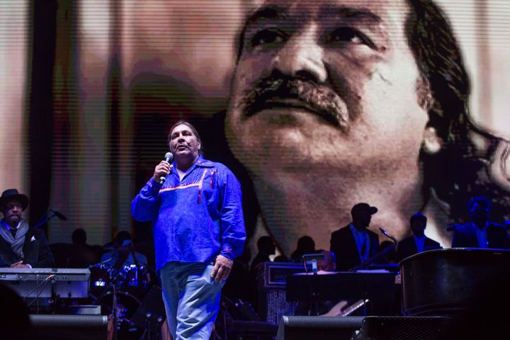Chauncey Peltier, son of political prisoner Leonard Peltier who is pictured on the video behind him, speaks at Harry Belafonte's Many Rivers Music, Art & Social Justice festival in October 2016.