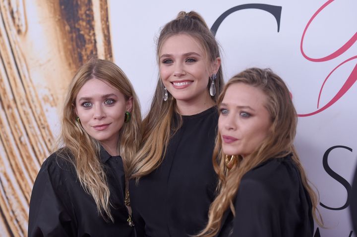 Mary-Kate and Ashley Olsen with their sister, actor Elizabeth Olsen (center) in 2016.