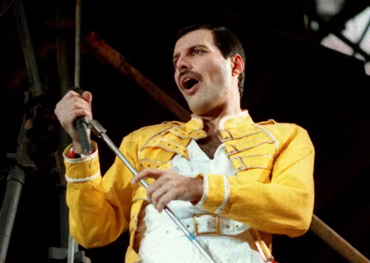 Freddie Mercury performs in Cologne, Germany, on July 20, 1986. Mercury's extensive collection of costumes, fine art, and even handwritten working lyrics to “We Are the Champions” will be auctioned in Sept. 2023.