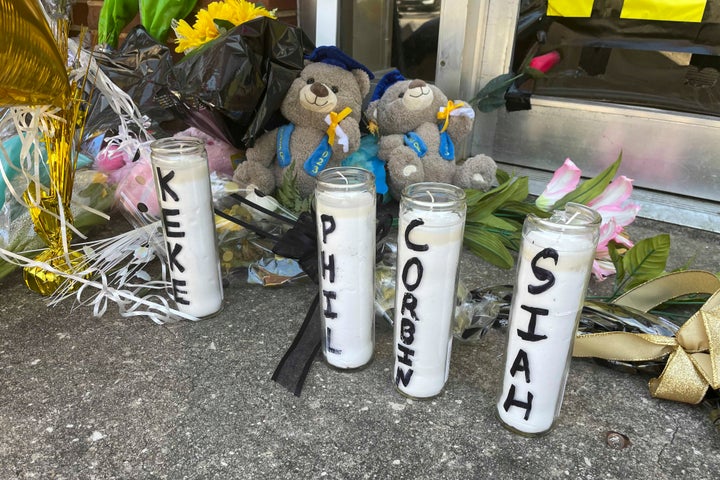 Candles with the names of the four young people killed in a shooting and teddy bears dressed in graduation caps sit outside the Mahogany Masterpiece dance studio on Wednesday, April 19, 2023, in Dadeville, Ala. Two teenagers have been arrested and charged with murder in connection with the shooting at a Sweet Sixteen birthday party, Alabama investigators announced Wednesday. 