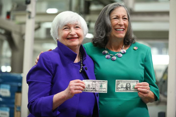 Treasury Secretary Janet Yellen and Treasurer Marilynn Malerba hold bills with their signatures during a visit to a Bureau of Engraving and Printing facility in Fort Worth, Texas, in 2022.