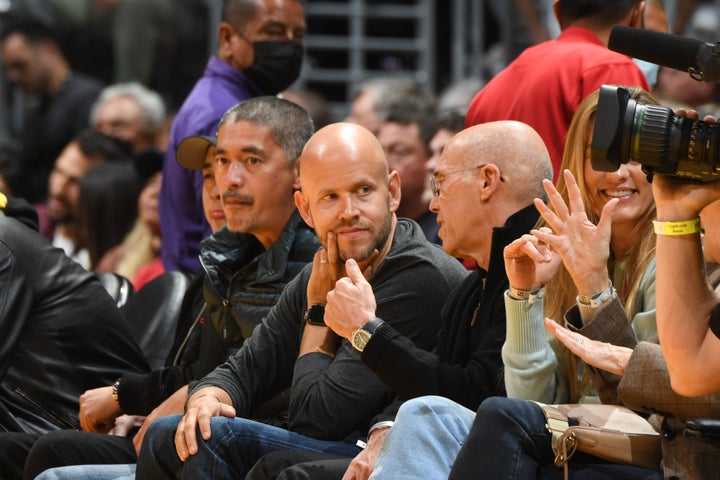 FILE: Spotify CEO Daniel Ek (center) attends a game between the Los Angeles Clippers and Los Angeles Lakers in Feb. 2022. Spotify has attempted to incorporate AI into its platform with its AI DJ feature, a feature that launched in February.