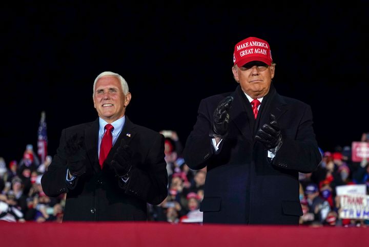 FILE - Then-President Donald Trump arrives for a campaign rally at Gerald R. Ford International Airport, Nov. 2, 2020, in Grand Rapids, Mich., with then-Vice President Mike Pence (AP Photo/Evan Vucci, File)