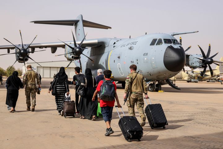 British nationals board an RAF aircraft in Sudan, for evacuation to Larnaca International Airport in Cyprus on April 26, 2023 in Khartoum, Sudan.