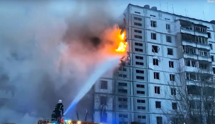 In this image taken from video provided by the National Police of Ukraine, firefighters work at an apartment building destroyed by a Russian attack in the town of Uman, around 215 kilometers (134 miles) south of Kyiv, Ukraine, Friday, April 28, 2023. 