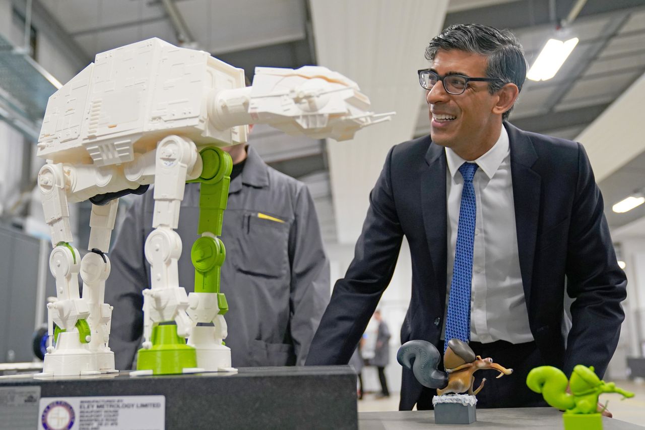 Star Wars buff Rishi Sunak is shown a 3-D printed model of one of the movie francise's All Terrain Armoured Transport Walkers during a visit to the UK Atomic Energy Authority in Abingdon, Oxfordshire.