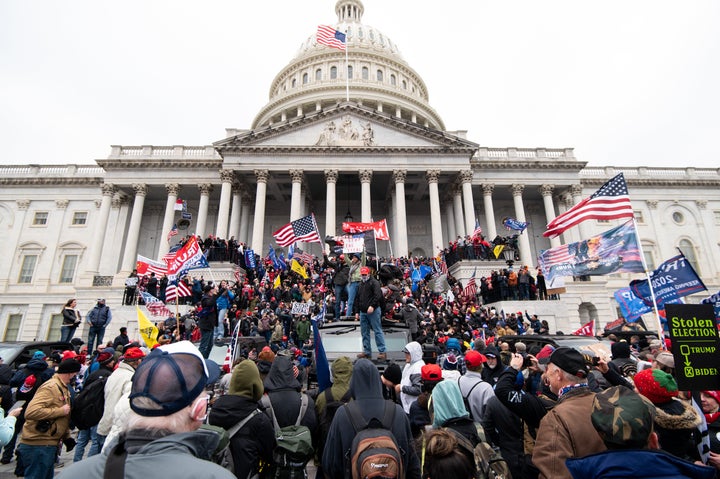 UNITED STATES - JANUARY 6: Trump flags fly as rioters take over the steps of the Capitol on the East Front on Wednesday, Jan. 6, 2021, as the Congress works to certify the electoral college votes. (Photo By Bill Clark/CQ-Roll Call, Inc via Getty Images)