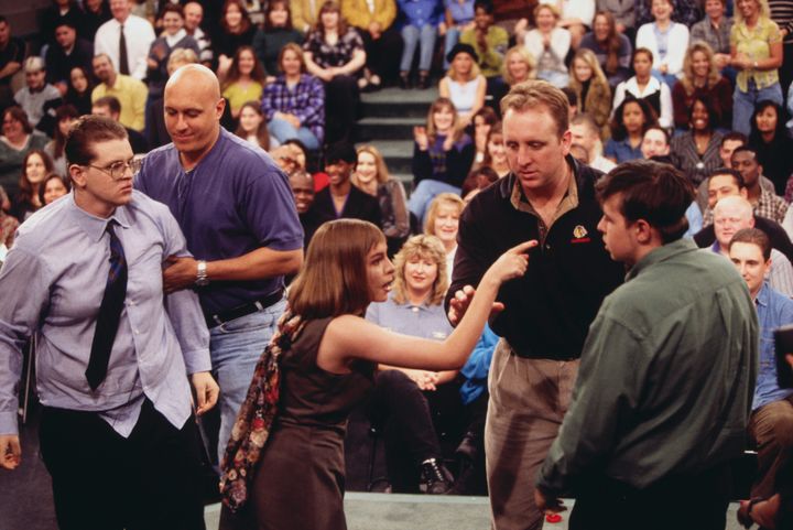 Security guard Steve Wilkos (second from left) and another guard separate and restrain fighting guests on the "Jerry Springer" show.