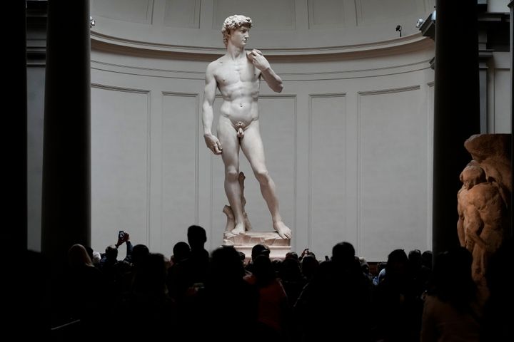 A former Florida school principal who was forced to resign after students were shown an image of Michelangelo’s iconic statue of a nude David viewed the masterpiece in person on Friday in Florence.(AP Photo/Alessandra Tarantino)