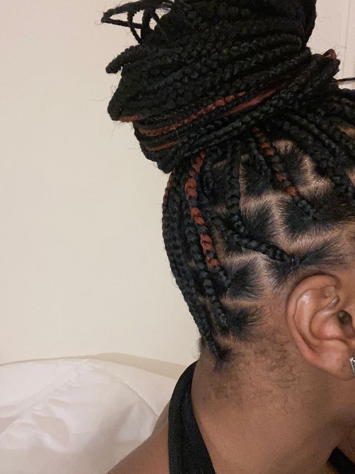 The author wearing her box braids hairstyle.