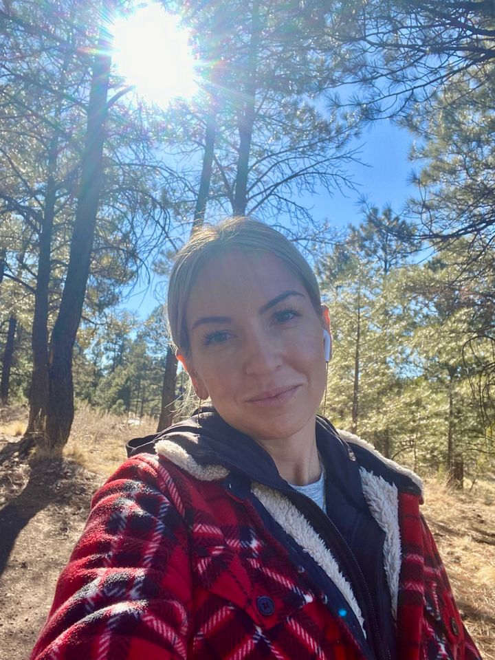 The author listening to a podcast and walking around her remote neighborhood on her solo trip in Flagstaff, Arizona, in 2022.