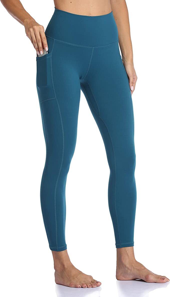A pair of high-waisted leggings with pockets that hit just above the ankle