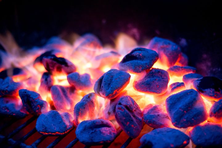 Charcoal briquettes contain wood chips and sawdust, and are often held together with chemical additives that extend their burn time and help them maintain their shape.