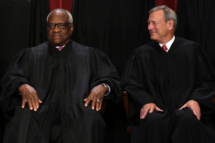Chief Justice John Roberts (at right) declined to testify to the Senate judiciary committee after reports revealed that Justice Clarence Thomas (left) failed to report gifts from billionaire Harlan Crow.
