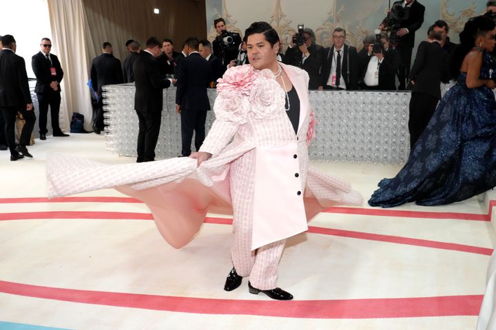 Harvey Guillén wears oversized flowers and pink tweed at the Met Gala.