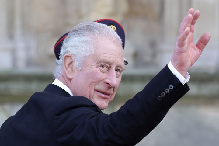 King Charles III waves to spectators as he and Queen Consort Camilla attend the Royal Maundy service on April 6, 2023, in York, England. 