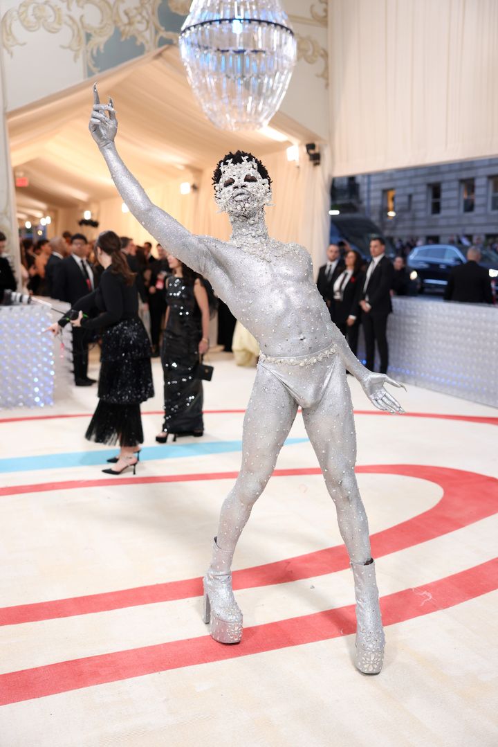 Lil Nas X covers body in silver paint, rhinestones for 2023 Met Gala