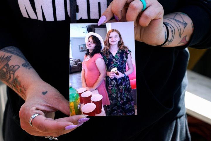 Ashley Webster shows a photo of her daughter Ivy Webster and her best friend Tiffany Guess.