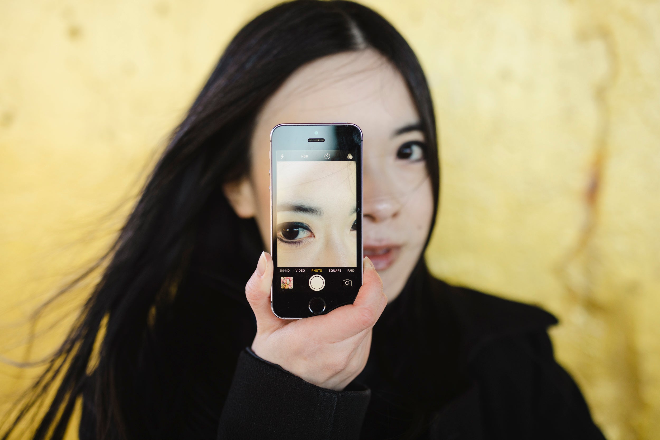 Artist and independent curator Jenny Lam poses for a portrait near Ping Tom Memorial Park in the Chinatown neighborhood of Chicago, Illinois.