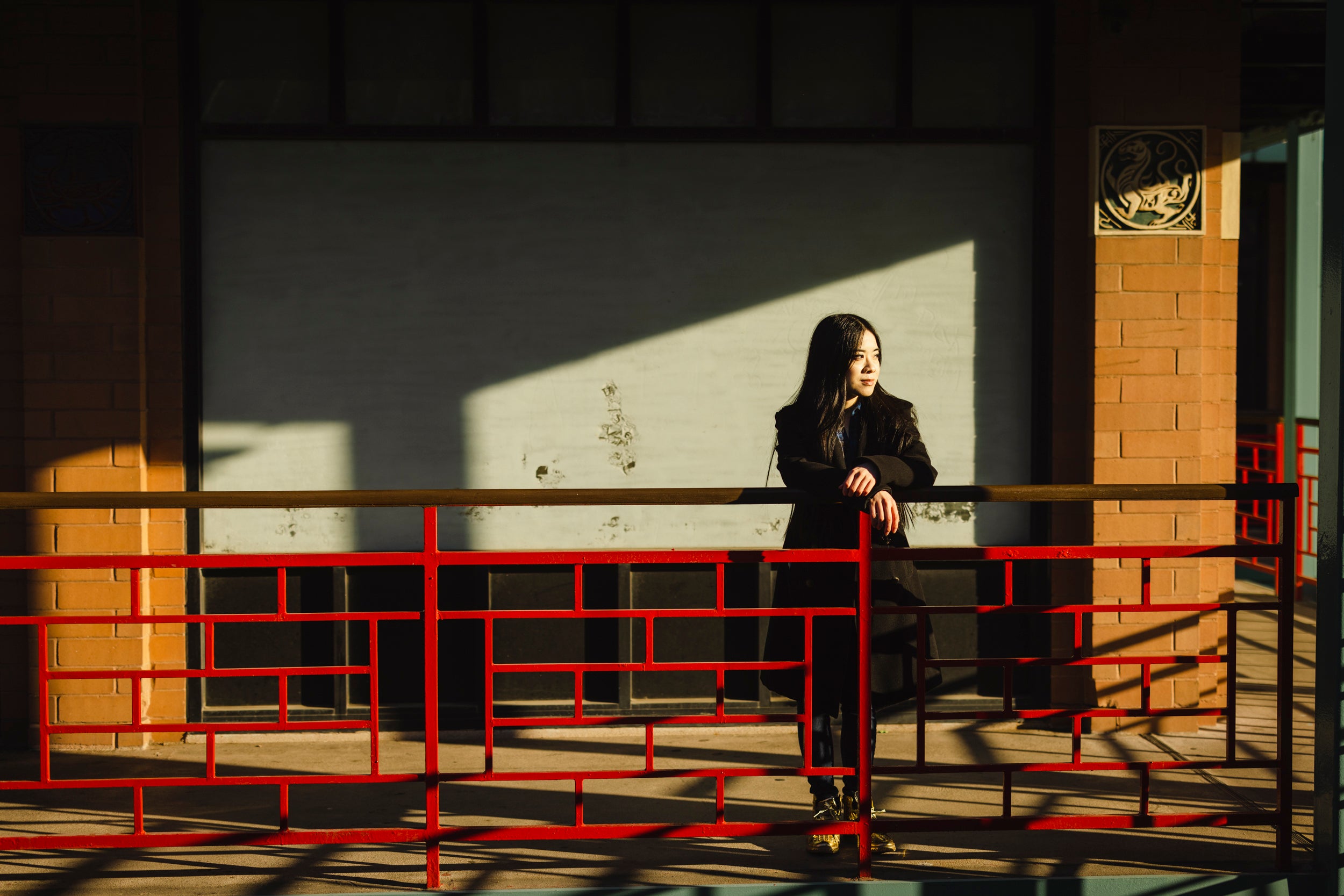 Artist and curator Jenny Lam poses for a portrait at Chinatown Square in Chicago.