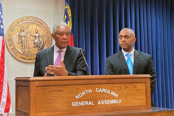 Senate Minority Leader Dan Blue (left) speaks while House Minority Leader Robert Reives listens at a news conference at the Legislative Building in Raleigh, on Feb. 7, 2022.