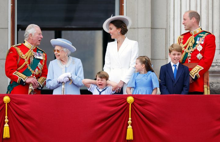 The then-Prince Charles, Queen Elizabeth II, Prince Louis, Kate Middleton, Princess Charlotte, Prince George and Prince William watch a flypast from the balcony of Buckingham Palace during Trooping the Colour on June 2, 2022.