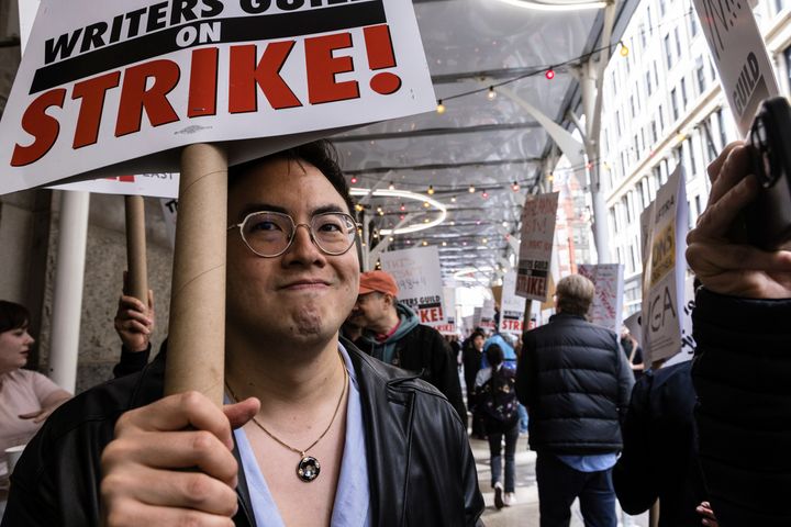 "Saturday Night Live" writer and cast member Bowen Yang pickets Wednesday with members of the Writers Guild of America outside Netflix headquarters in Manhattan.