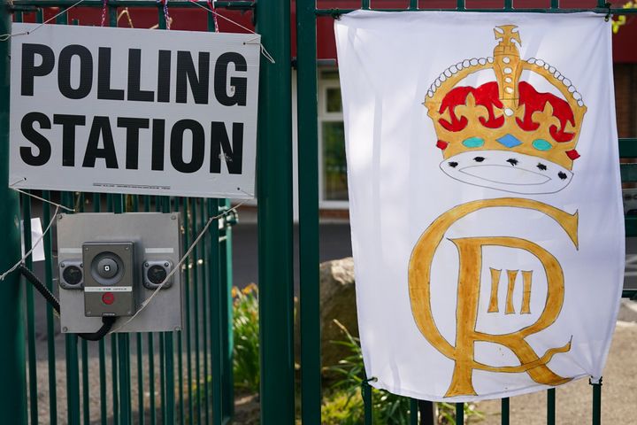 King Charles III Coronation flags hang from a fence at a polling station as people go to the polls in the local elections on May 04, 2023 in Middlesbrough.