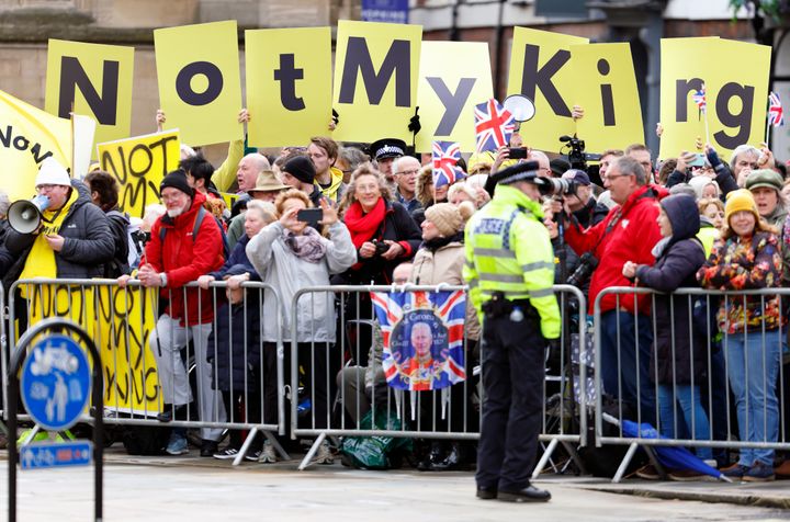 Anti-monarchy protestors from the pressure group Republic wave 'Not My King' banners during a royal visit from Charles and Camilla