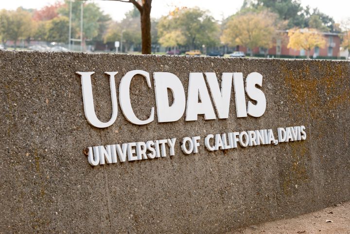Davis, Сalifornia, USA - November 11, 2013: Street sign of UC Davis, in Davis, CA.