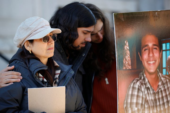 Family members of Manuel Esteban Paez Terán embrace during a news conference in Decatur, Georgia.