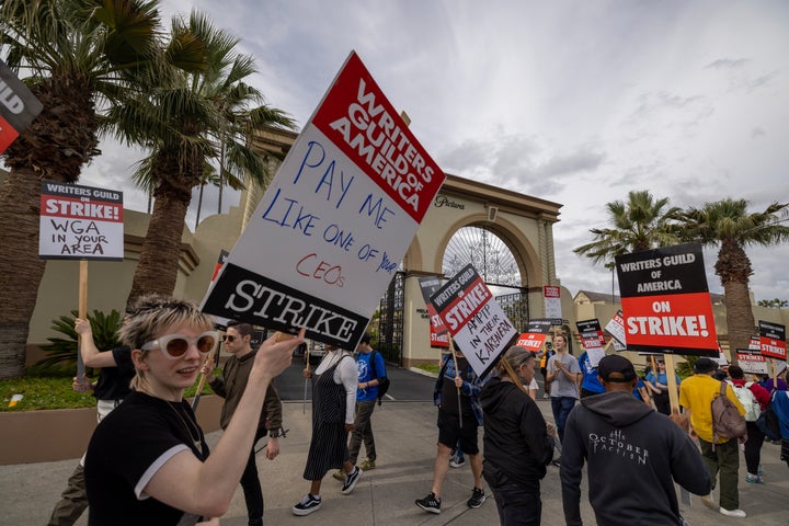 Film and TV writers represented by the Writers Guild of America, West picket outside of Paramount Pictures studios during the Hollywood writers strike on Thursday in Los Angeles.