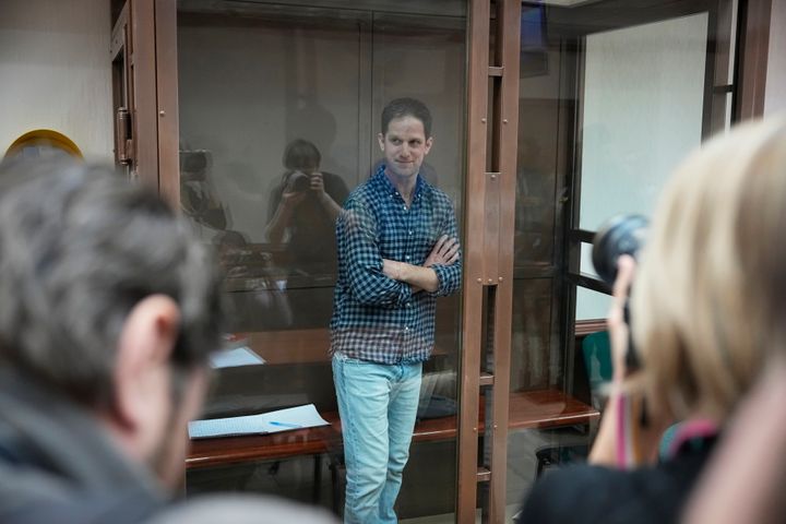 Wall Street Journal reporter Evan Gershkovich stands in a glass cage in a courtroom at the Moscow City Court, in Moscow, Russia, on Tuesday, April 18, 2023. 