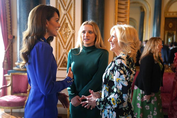 Britain's Catherine, Princess of Wales, speaks with first lady Jill Biden and her granddaughter Finnegan Biden during a reception for overseas guests attending the coronation of Britain's King Charles III.